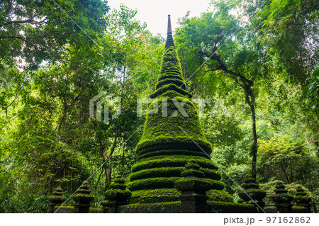 Ancient pagoda with moss plant at Phlio waterfall park, Chanthaburi 97162862