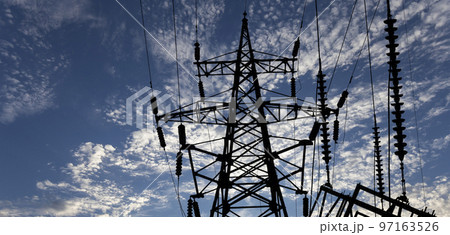 Electricity pylon (high voltage power line), black contour, on the background of the cloudy sky Electricity pylon (high voltage power line), black contour, on the background of the cloudy sky 97163526