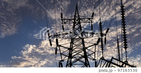 Electricity pylon (high voltage power line), black contour,  against the background of a romantic evening sky 97163530