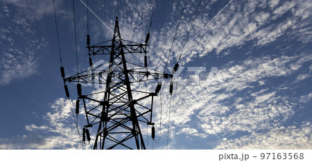 Electricity pylon (high voltage power line), black contour, on the background of the cloudy sky Electricity pylon (high voltage power line), black contour, on the background of the cloudy sky 97163568