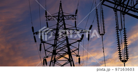 Electricity pylon (high voltage power line), black contour, against the background of a romantic evening sky Electricity pylon (high voltage power line), black contour, against the background of a romantic evening sky 97163603
