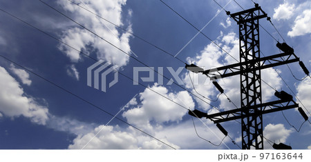 Electricity pylon (high voltage power line), black contour,  on the background of the cloudy sky 97163644