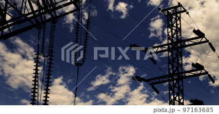 Electricity pylon (high voltage power line), black contour,  against the background of a romantic evening sky 97163685