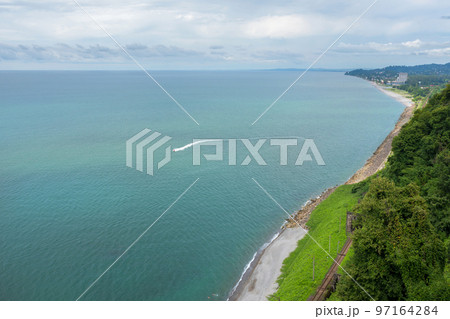 A beautiful view on the sea. A boat floating on the sea 97164284