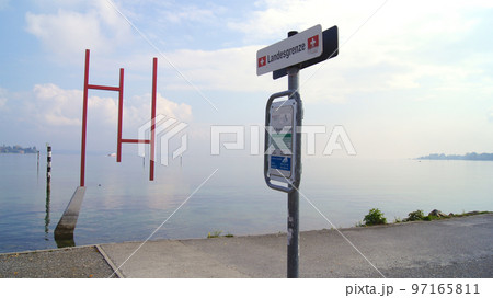 KONSTANZ, GERMANY - 14 OCT 2015: The border between Germany and Switzerland right on Lake Constance KONSTANZ, GERMANY - 14 OCT 2015: The border between Germany and Switzerland right on Lake Constance 97165811