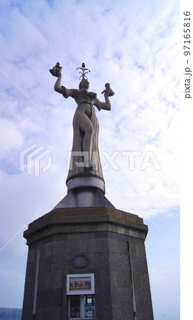 KONSTANZ, GERMANY - OCT 14, 2015: Imperia is a statue in the harbour of Konstanz on Lake Constance. The figure, which was erected in 1993, is cast in concrete, nine metres high, weighs 18 tonnes and KONSTANZ, GERMANY - OCT 14, 2015: Imperia is a statue in the harbour of Konstanz on Lake Constance. The figure, which was erected in 1993, is cast in concrete, nine metres high, weighs 18 tonnes and 97165816