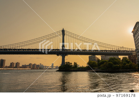 Manhattan bridge photo in profile in the tones of the rising sun Manhattan bridge photo in profile in the tones of the rising sun 97169178