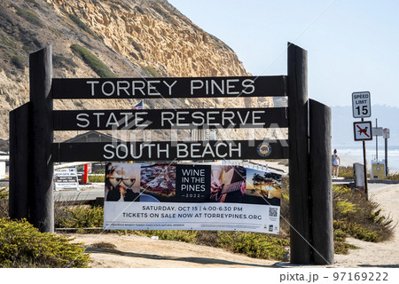 San Diego, USA. September 20, 2022. Sign boards and advertisement posters with mountain in the background at Torrey Pines State Reserve 97169222