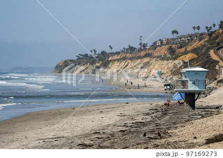San Diego, USA. September 20, 2022. Tourists enjoying vacations on shore at beach with clear blue sky in background during sunny day San Diego, USA. September 20, 2022. Tourists enjoying vacations on shore at beach with clear blue sky in background during sunny day 97169273