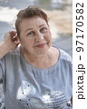 Portrait of a friendly elderly woman 97170582