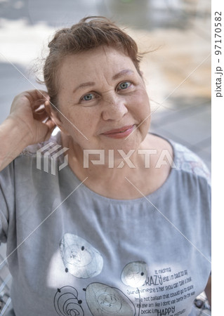 Portrait of a friendly elderly woman Portrait of a friendly elderly woman 97170582