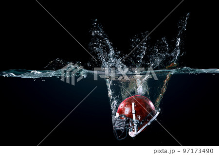 American football helmet in water American football helmet in water 97173490