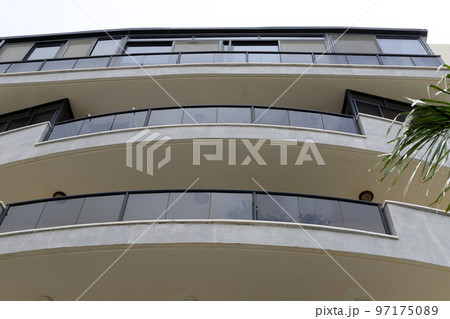 Balcony - a platform with railings protruding on the upper floors of the building. 97175089