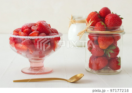 Tasty fresh strawberries in a glass bowl with creme fraiche 97177218