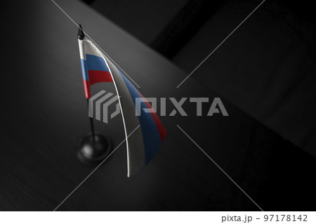 Small national flag of the Russia on a black background Small national flag of the Russia on a black background 97178142