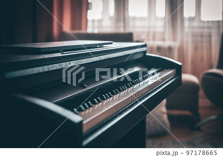 Electronic piano in the interior of the room on a blurred background. Electronic piano in the interior of the room on a blurred background. 97178665