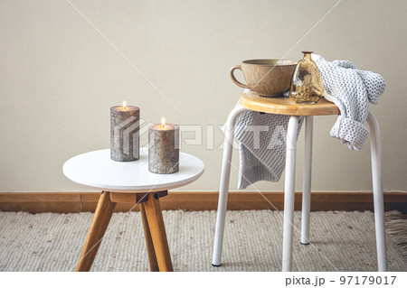 Minimalistic still life with candles in the interior of the room. 97179017