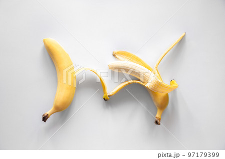 Two bananas on a white background isolated, conceptual minimalism. 97179399