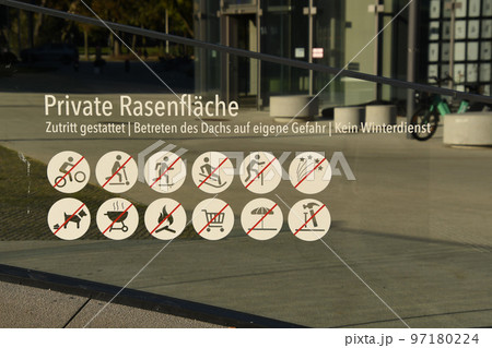 Prohibition sign for a private lawn with several prohibitions in Duesseldorf, Germany Prohibition sign for a private lawn with several prohibitions in Duesseldorf, Germany 97180224