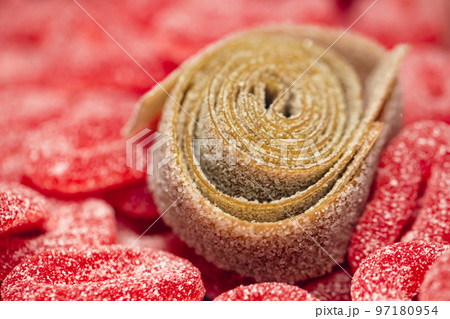 Red gummies jelly candies in sugar, background. 97180954