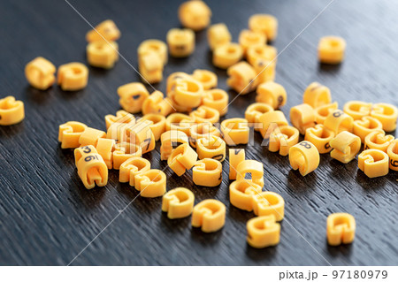 Cable markers scattered on the table, macro shot. 97180979