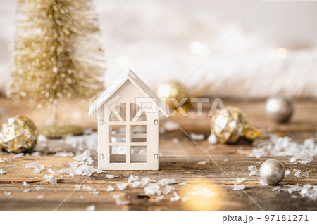 Small wooden house on a blurred background with bokeh, Christmas background. 97181271