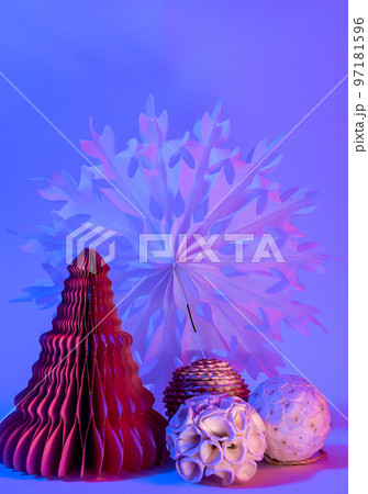Decorative paper Christmas trees on blue background with trendy neon light. Decorative paper Christmas trees on blue background with trendy neon light. 97181596