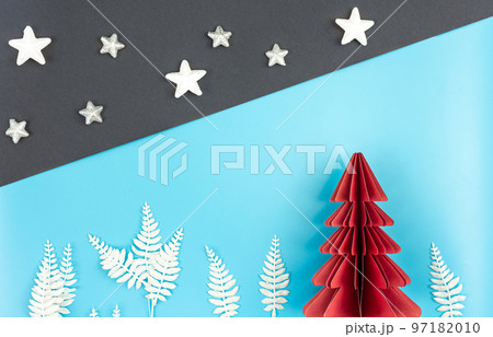 Christmas background with origami paper tree on paper background, flat lay. Christmas background with origami paper tree on paper background, flat lay. 97182010