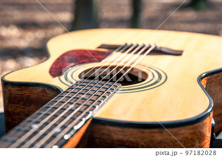 Close-up, classical acoustic guitar, soft focus in daylight. Close-up, classical acoustic guitar, soft focus in daylight. 97182028