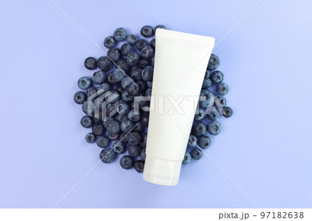 White squeeze bottle cosmetic tube pack and blueberry a lot on purple background. Mockup. Daily cream, gel, skin care, sunscreen, moisturizer, toothpaste. Front view, blank tube, template, flat lay White squeeze bottle cosmetic tube pack and blueberry a lot on purple background. Mockup. Daily cream, gel, skin care, sunscreen, moisturizer, toothpaste. Front view, blank tube, template, flat lay 97182638