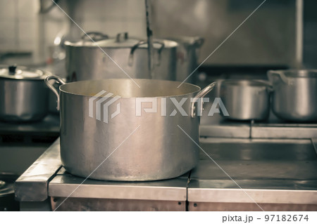 Large metal pans in an industrial kitchen. 97182674