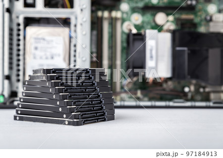 Closed-up view of SSD hard disk drives with PC in the background Closed-up view of SSD hard disk drives with PC in the background 97184913