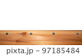 Top view light wood texture surface with natural pattern and metal nail heads or hats. Wooden pine board isolated on white. Spruce table with knots. Rustic craft. Workbench. Box edge. 97185484