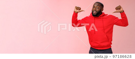 Proud confident arrogant good-looking african american bearded male coworker in red hoodie raise thumbs pointing himself bragging look cheeky talking accomplishments himself, standing pink wall Proud confident arrogant good-looking african american bearded male coworker in red hoodie raise thumbs pointing himself bragging look cheeky talking accomplishments himself, standing pink wall 97186628