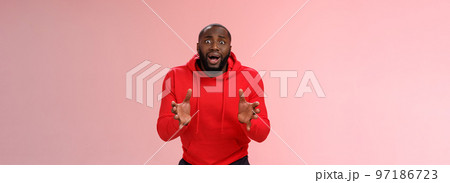Worried guy asking be careful look how carelessly employee carry fragule things frowning look concerned bending gesturing shocked perplexed standing nervously pink background 97186723