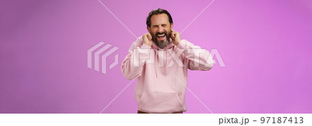 Annoyed fed up pressured caucasian adult man bearded yelling pissed close eyes cringing disgust annoyance close ears bothered cannot stand loud awful noise, grimacing shouting turn off music Annoyed fed up pressured caucasian adult man bearded yelling pissed close eyes cringing disgust annoyance close ears bothered cannot stand loud awful noise, grimacing shouting turn off music 97187413