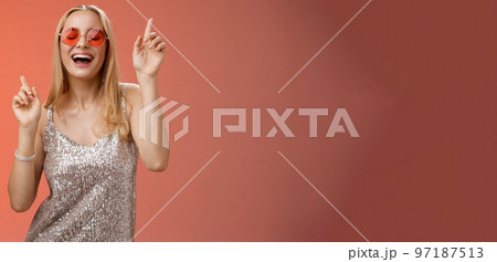 Amused attractive happy smiling woman dancing nightclub having fun enjoying go wild party celebrating b-day wearing stylish dress sunglasses raise index fingers smiling singing along Amused attractive happy smiling woman dancing nightclub having fun enjoying go wild party celebrating b-day wearing stylish dress sunglasses raise index fingers smiling singing along 97187513