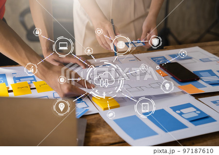 Creative digital development agency.  developer team brainstorming on their project with laptop, smartphone and digital tablet. 97187610