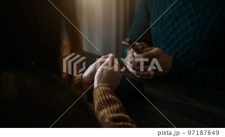 Asian men and women hands praying to god with the bible. Pray for god blessing. Religious beliefs Christian life crisis prayer to god. Asian men and women hands praying to god with the bible. Pray for god blessing. Religious beliefs Christian life crisis prayer to god. 97187649