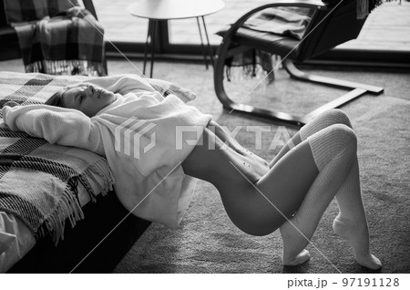 Young naked woman in home. Black and white image. 97191128