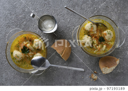 Soup with meatballs and herbs 97193189