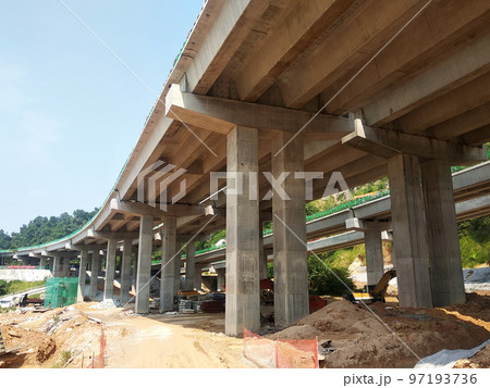 SELANGOR, MALAYSIA -JULY 6, 2022: An elevated road is under construction. Reinforced concrete is used for the structure. Construction is done in stages according to the sequence of works. 97193736