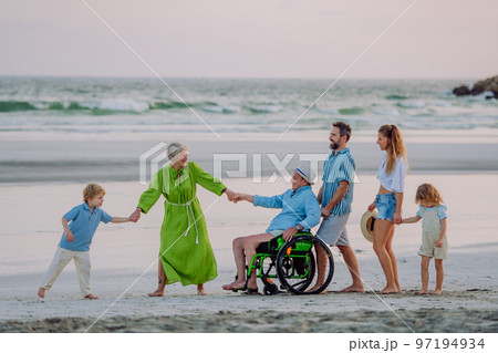 Multi generations family with little kids enjoying time at sea in exotic country. Multi generations family with little kids enjoying time at sea in exotic country. 97194934
