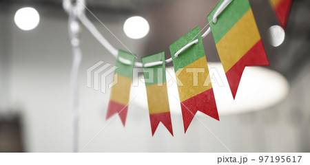 A garland of Mali national flags on an abstract blurred background 97195617