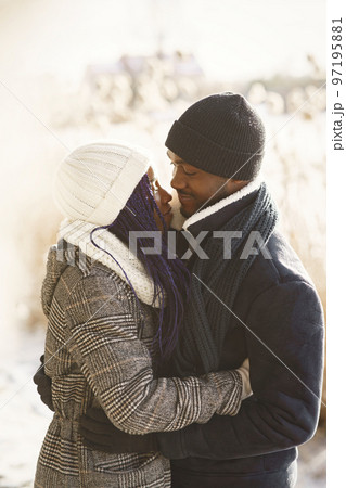 People walks outside. Winter day. African couple 97195881