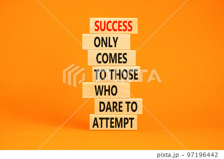 Success symbol. Concept words Success only comes to those who dare to attempt on wooden blocks. Beautiful orange background copy space. Business success and attempt concept. 97196442