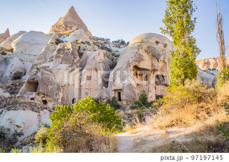 Beautiful stunning view of the mountains of Cappadocia and cave houses. Turkey Beautiful stunning view of the mountains of Cappadocia and cave houses. Turkey 97197145