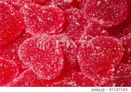 A close-up of marmalade in the form of a heart. A close-up of marmalade lollipops 97197163