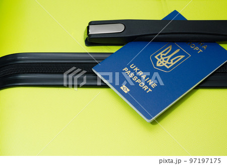 Passport of Ukraine and luggage at the airport. Suitcase close-up 97197175