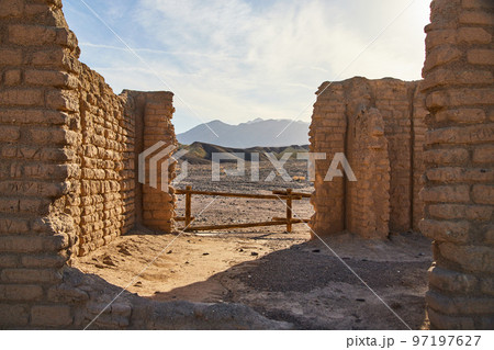 View into abandoned stone structure in Death Valley with stunning mountains in background View into abandoned stone structure in Death Valley with stunning mountains in background 97197627